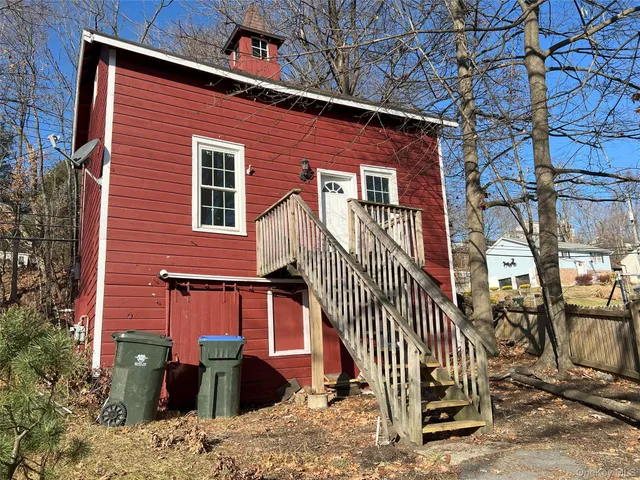 front view of a house with a bench