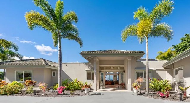 front view of a house with a potted plant