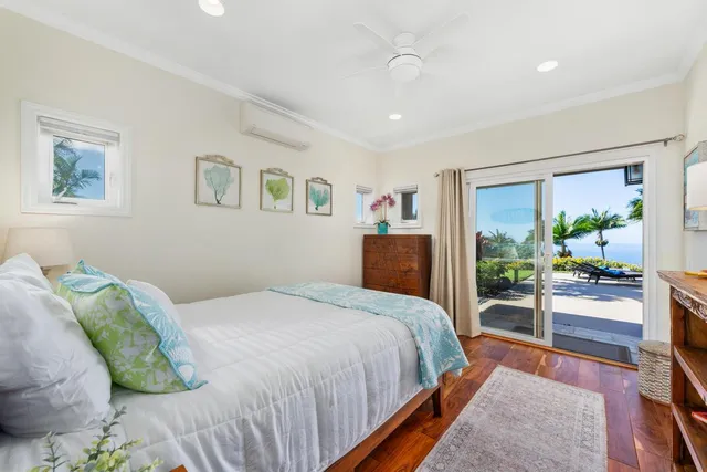 a bed room with a bed and a painting on the wall