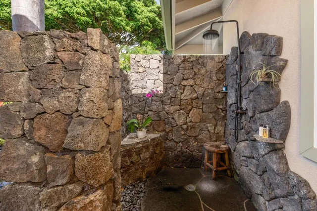 a lobby with furniture and a potted plant