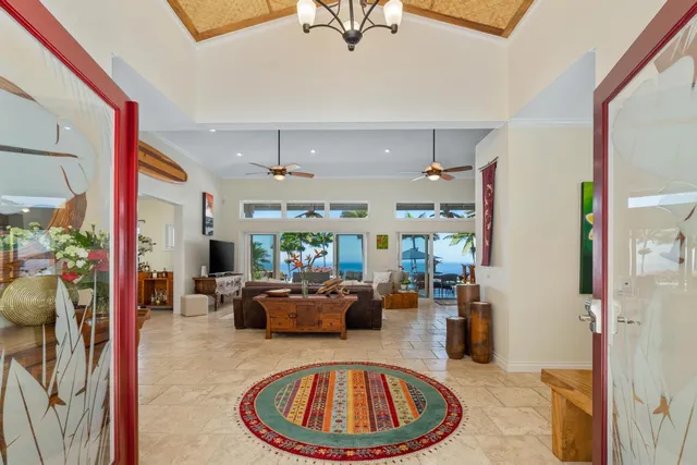 a living room with furniture a rug and a large window