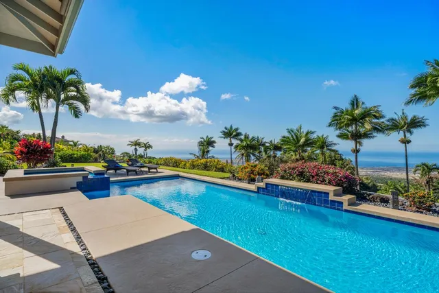 a view of a swimming pool and lounge chair