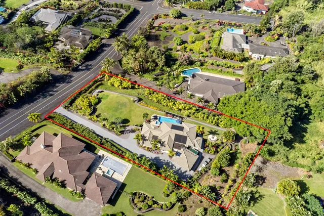 an aerial view of a residential houses with outdoor space