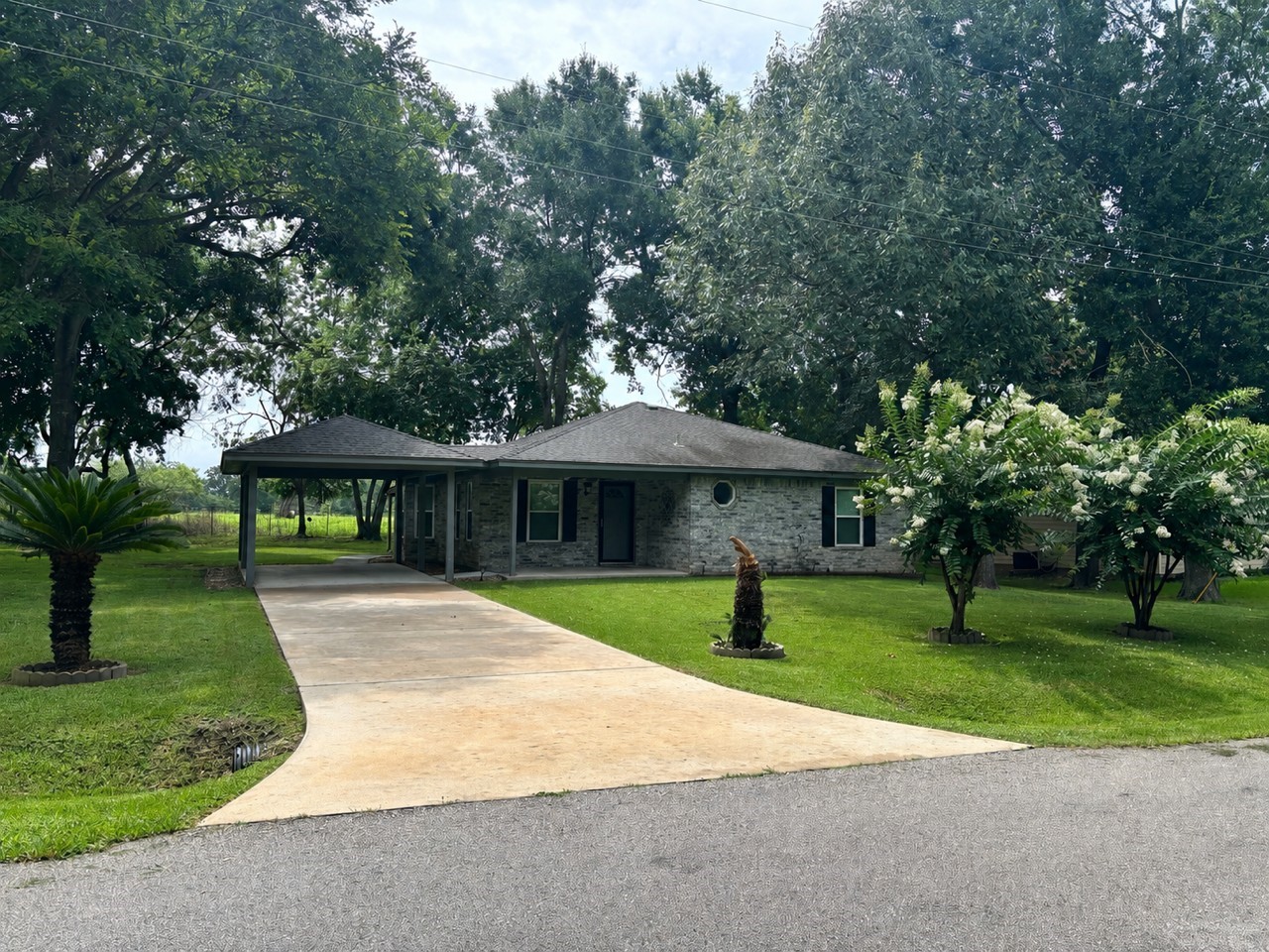 11950 North Ridgeway Willis, TX 77318 - Photo 1 of 15 a view of outdoor space with yard and green space