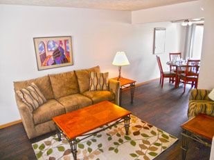 901 North 35th Street, Unit 147 Other, IA 51501 - Photo 7 of 11 a living room with furniture a rug and a table