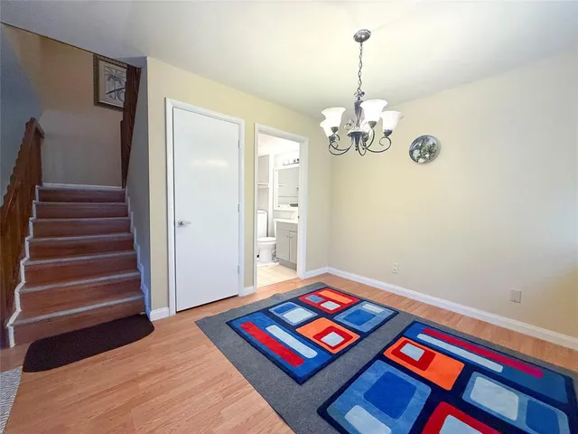 a room with a bed and a chandelier