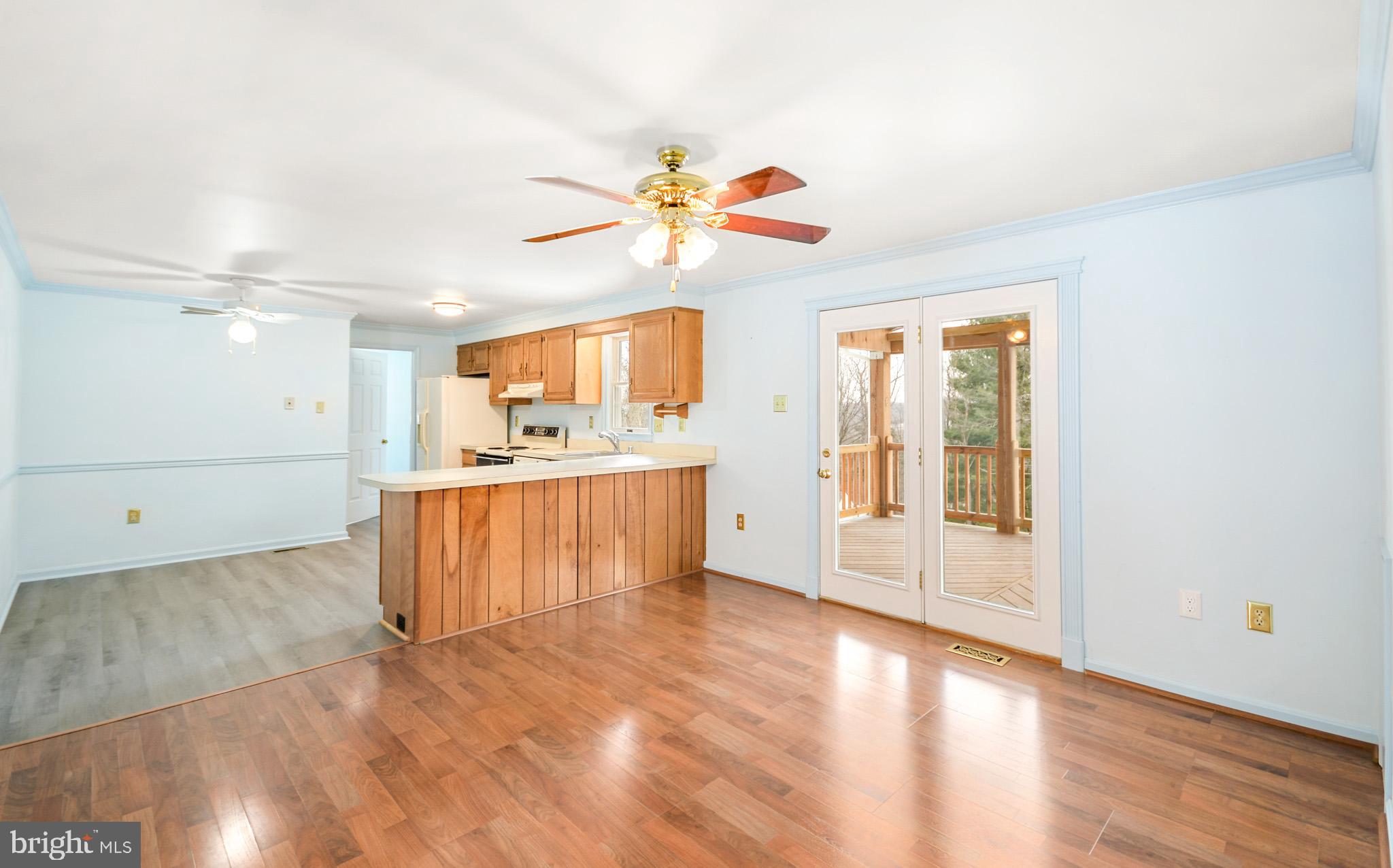 9946 Kelly Road Frederick, MD 21701 - Photo 6 of 23 Large dining area opening onto covered deck