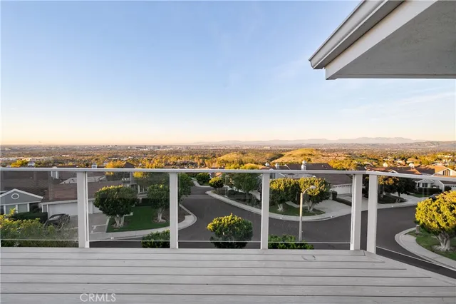 a view of a balcony with wooden floor
