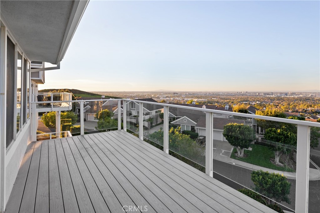 6 Saros, Unit 68 Irvine, CA 92603 - Photo 13 of 35 a view of a balcony with wooden floor