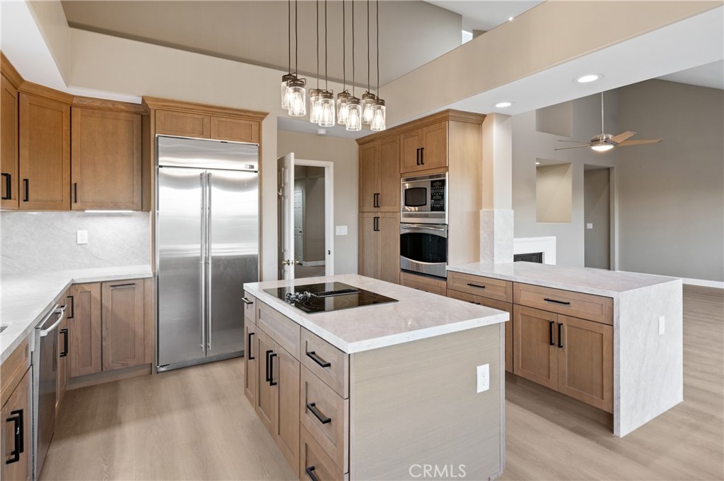 6 Saros, Unit 68 Irvine, CA 92603 - Photo 20 of 35 a kitchen that has a lot of cabinets in it