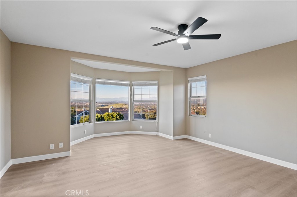 6 Saros, Unit 68 Irvine, CA 92603 - Photo 25 of 35 an empty room with window and ceiling fan
