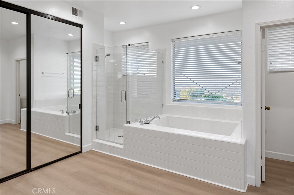6 Saros, Unit 68 Irvine, CA 92603 - Photo 27 of 35 a bathroom with a bathtub and a shower