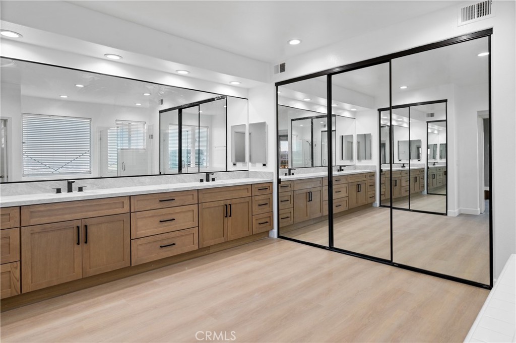 6 Saros, Unit 68 Irvine, CA 92603 - Photo 29 of 35 a spacious bathroom with a double vanity sink mirror and double