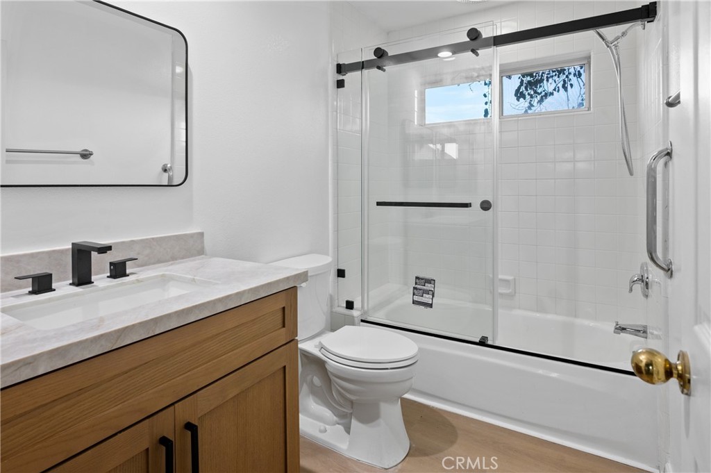 6 Saros, Unit 68 Irvine, CA 92603 - Photo 31 of 35 a bathroom with a granite countertop sink toilet and shower
