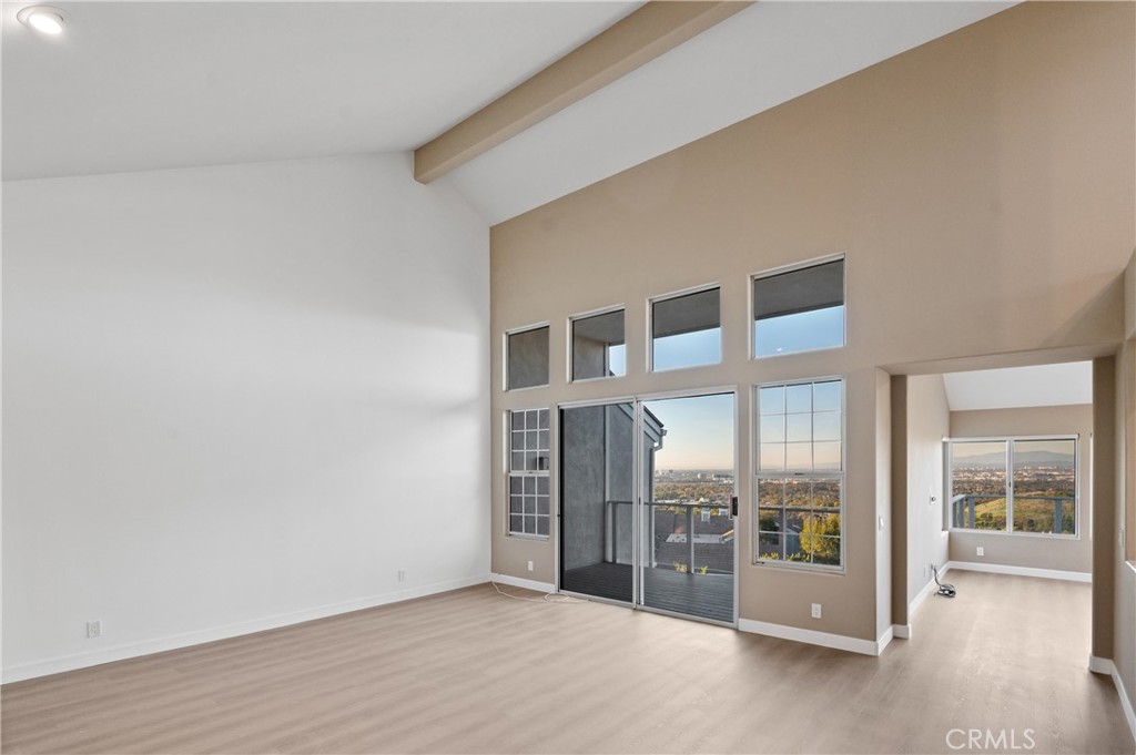 6 Saros, Unit 68 Irvine, CA 92603 - Photo 6 of 35 a view of an empty room with glass door