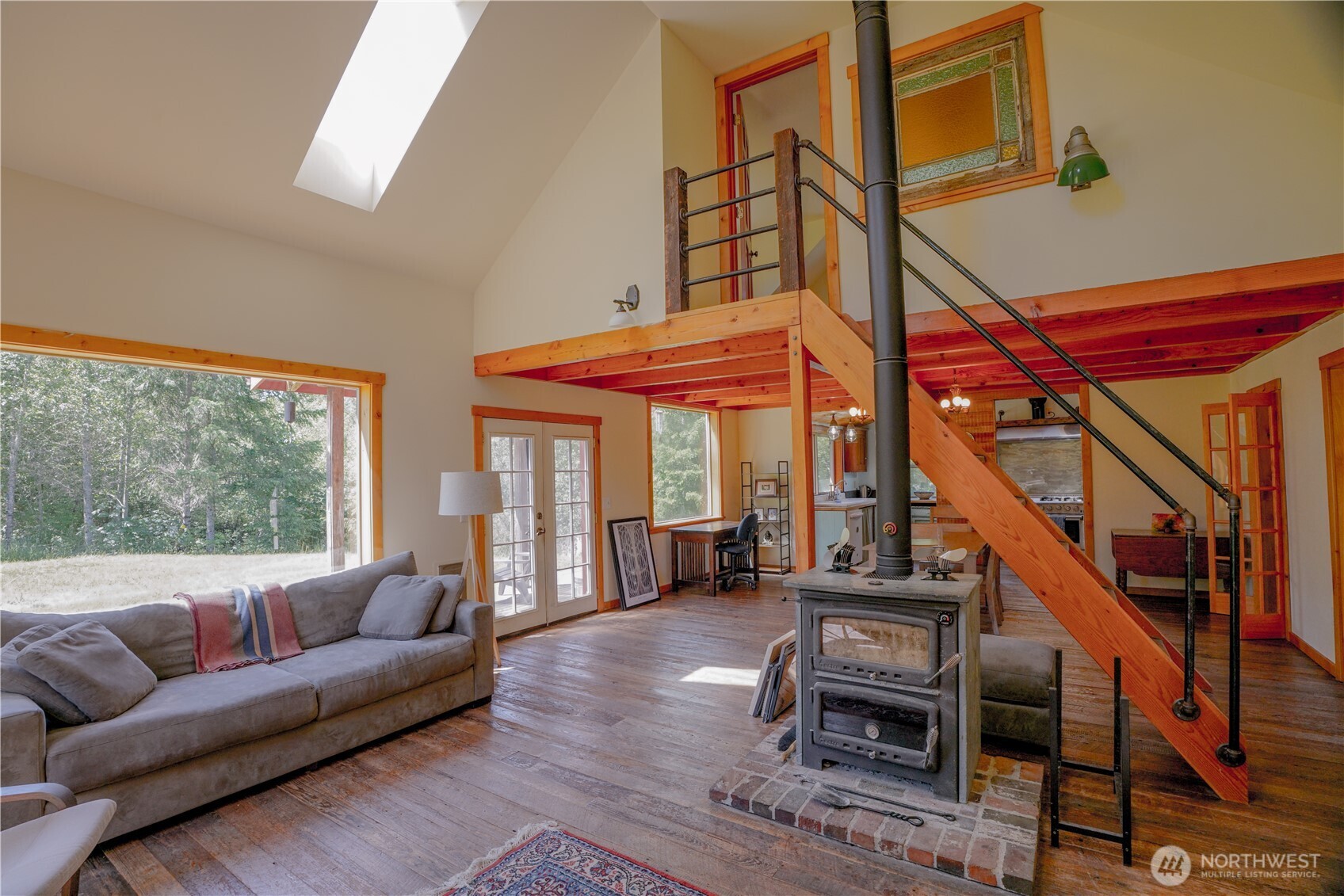 2904 Wildwood Road Quilcene, WA 98376 - Photo 3 of 39 a living room with furniture and a large window