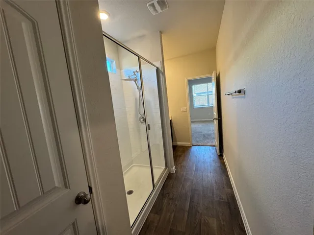 a bathroom with a double vanity sink and mirror