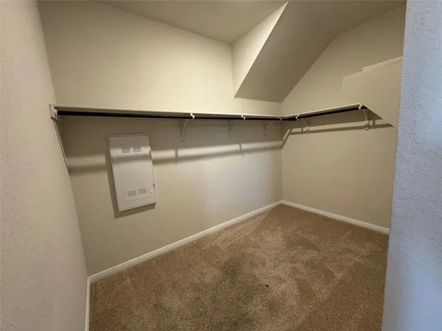 a bathroom with a glass shower door and a sink