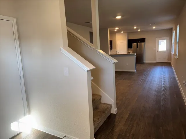 a view of entryway with wooden floor
