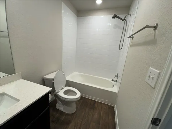 a bathroom with a sink a mirror and vanity