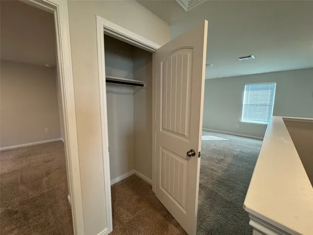 a view of a room with a wardrobe space