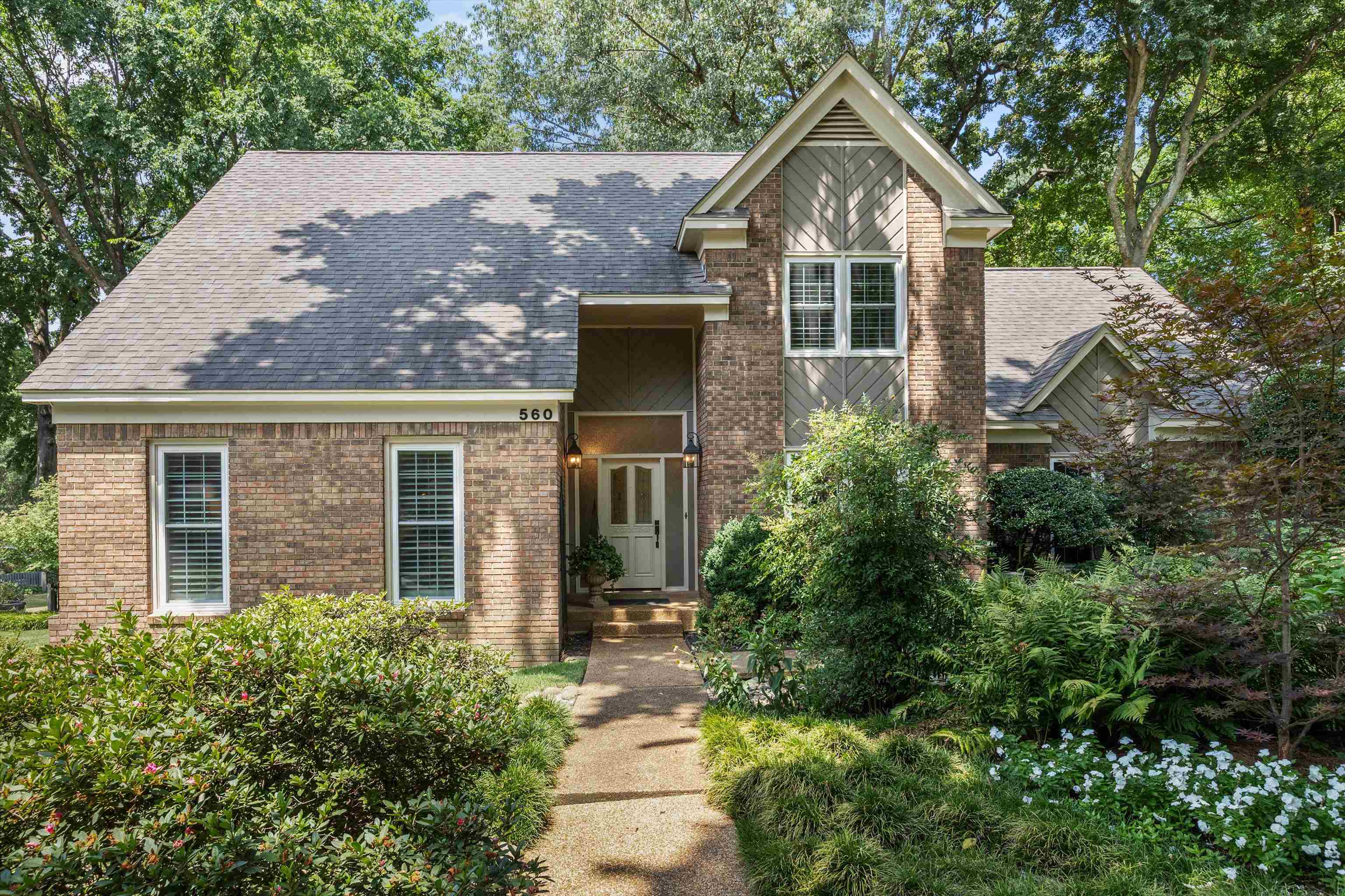 front view of a house with a yard
