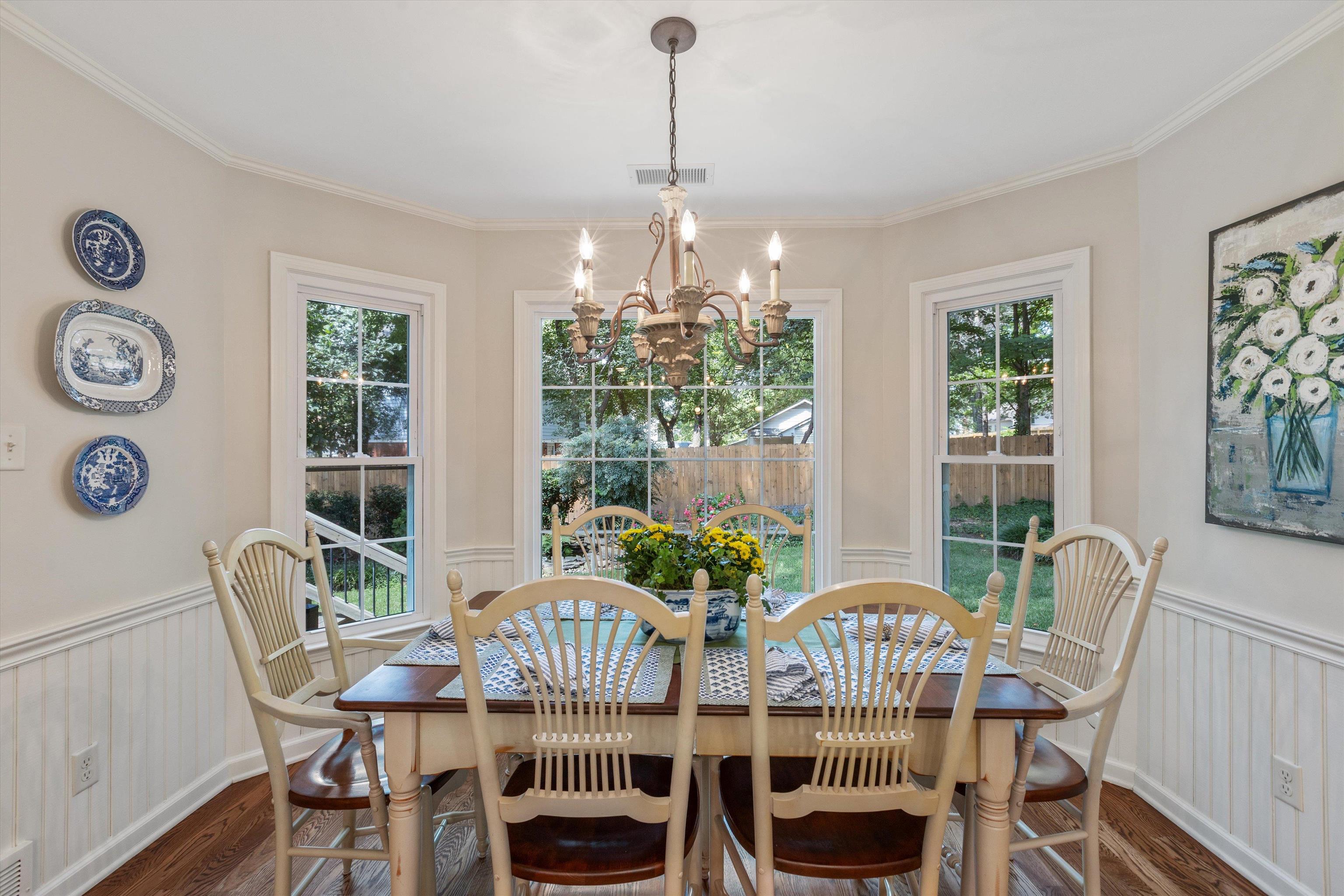 560 Silverman Drive Collierville, TN 38017 - Photo 9 of 31 a view of a dining room with furniture a chandelier and wooden floor