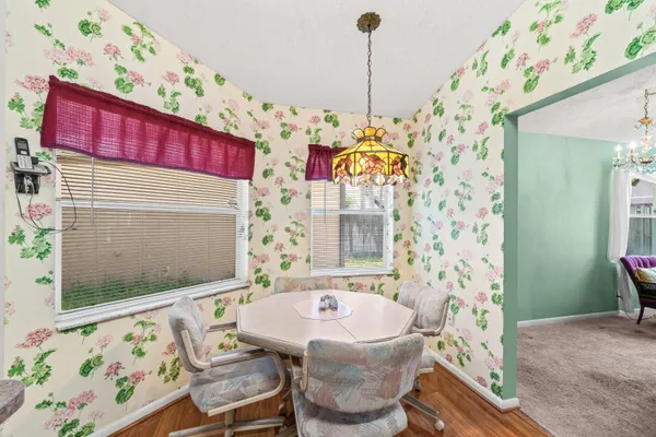 a kitchen with a sink stove and refrigerator