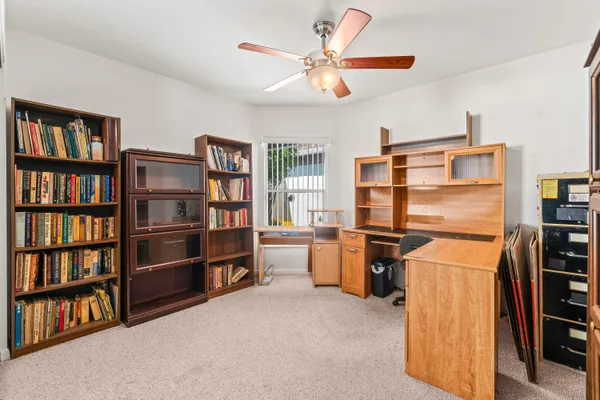 a view of a workspace with furniture