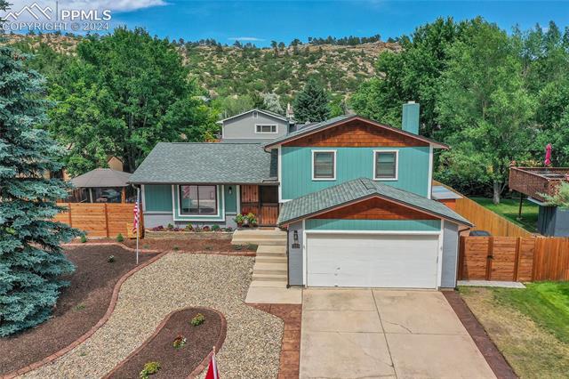 5255 Pinon Valley Road Colorado Springs, CO 80919 - Photo 40 of 47 View of front of house with a garage