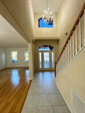 a view of entryway and hall with a front door