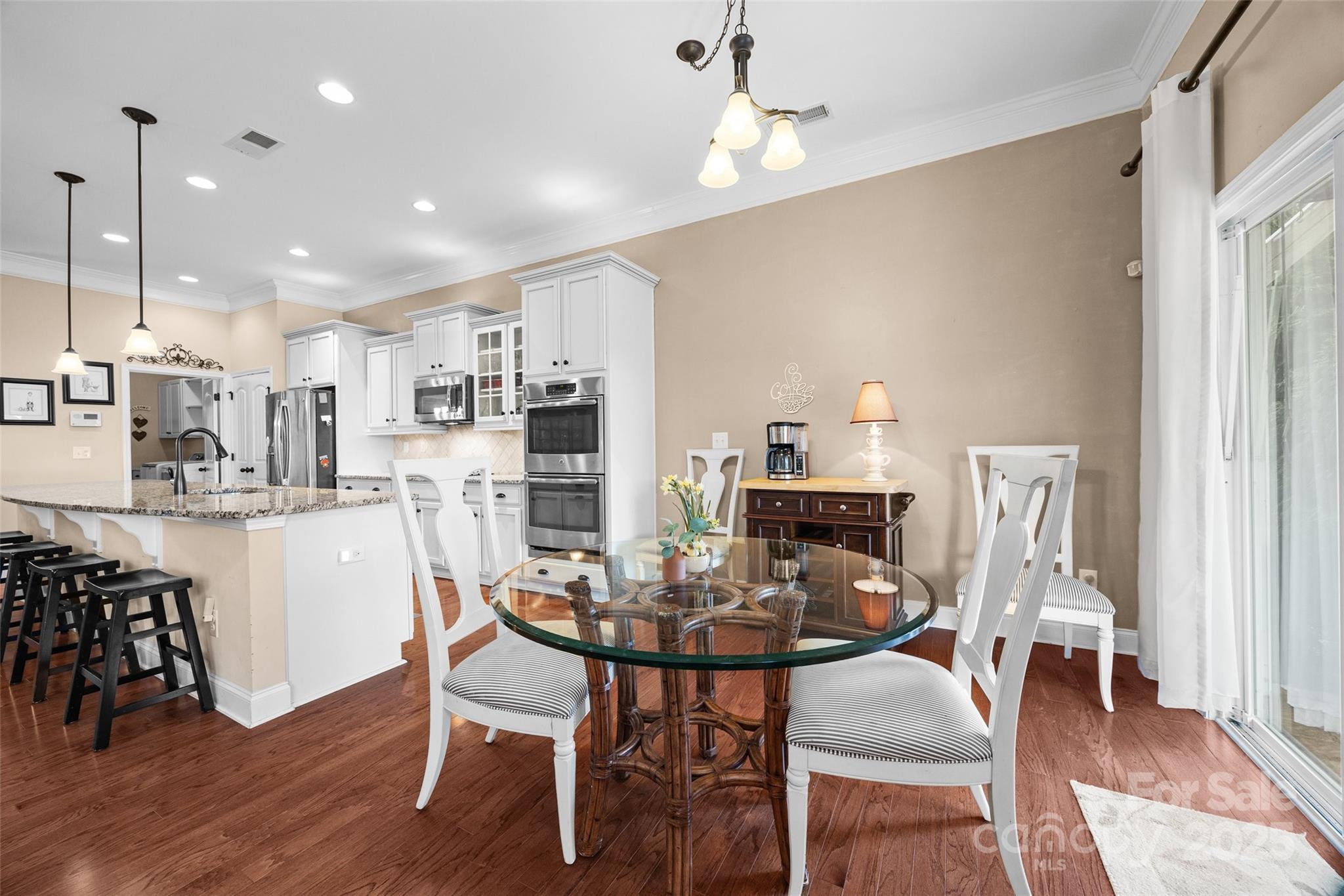 1617 Fig Branch Road Clover, SC 29710 - Photo 15 of 33 a view of a dining room with furniture and wooden floor