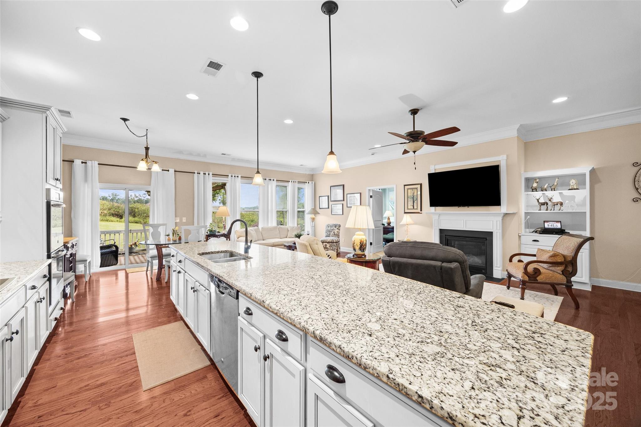 1617 Fig Branch Road Clover, SC 29710 - Photo 17 of 33 a large kitchen with kitchen island a large center island and a wooden floor