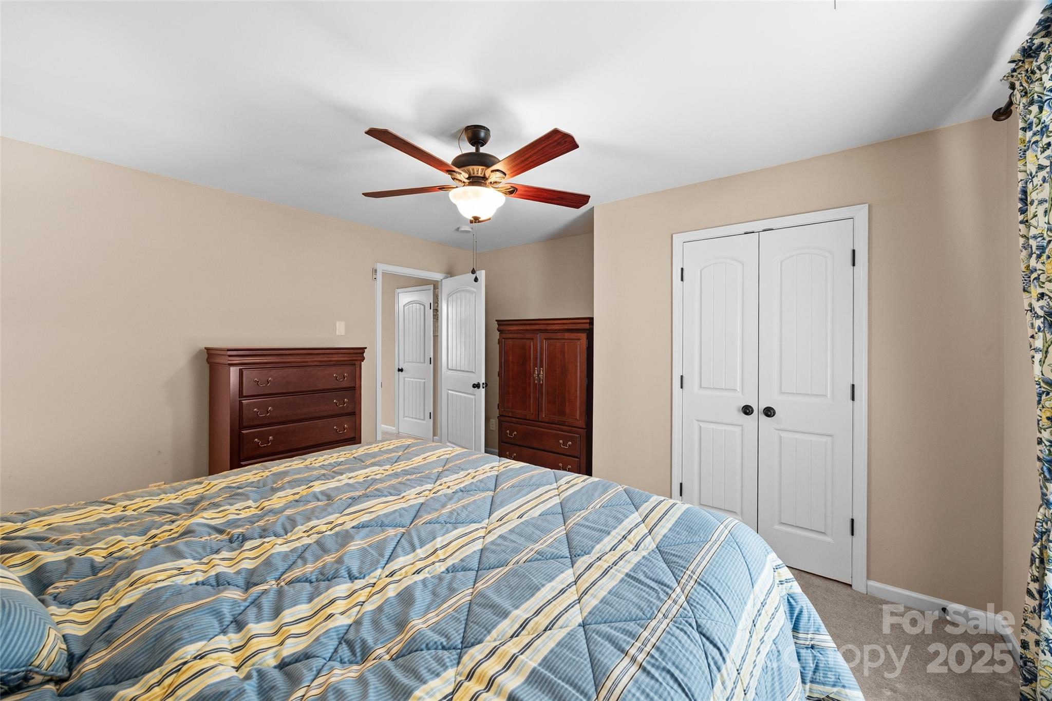 1617 Fig Branch Road Clover, SC 29710 - Photo 27 of 33 a bedroom with a bed and a chandelier