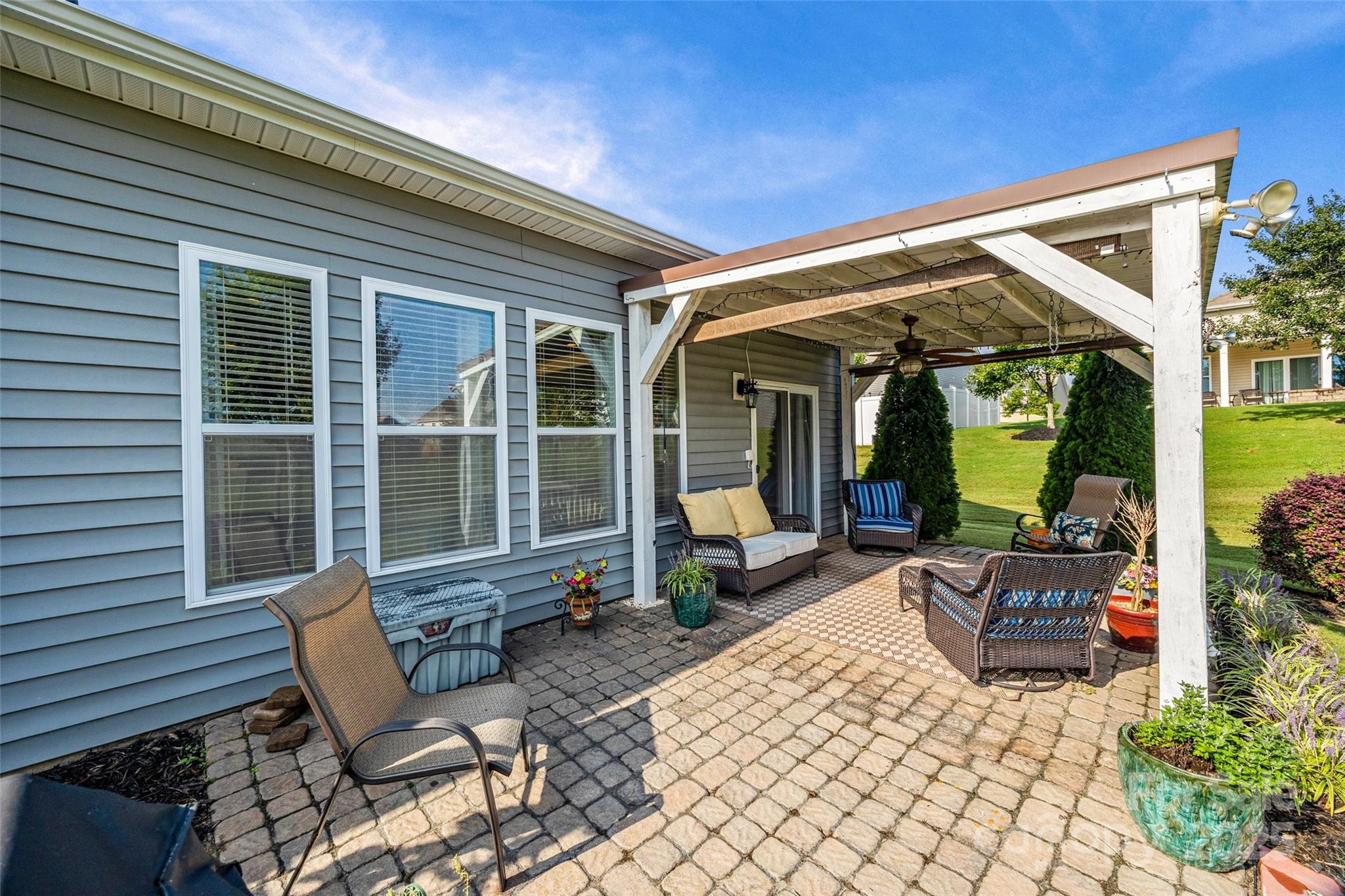 1617 Fig Branch Road Clover, SC 29710 - Photo 30 of 33 a view of a patio with table and chairs and potted plants