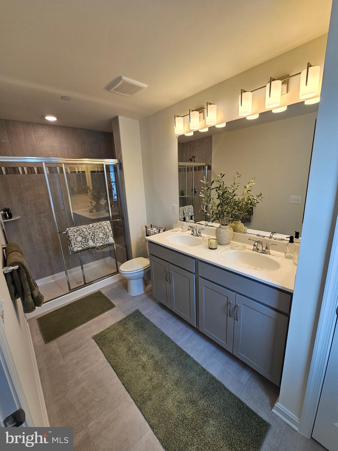 7304 Roxy Run, Unit 8 Clinton, MD 20735 - Photo 21 of 27 a bathroom with a double vanity sink a mirror and a bathtub