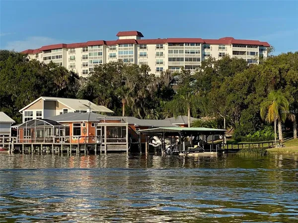 a view of a lake with a house in the background