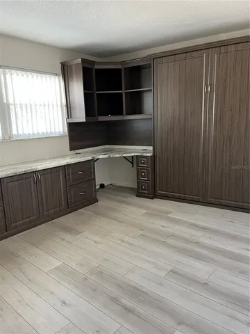 a kitchen with a cabinets and a window