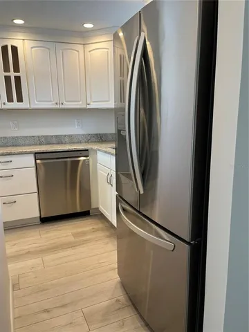 a view of a kitchen with washer and dryer