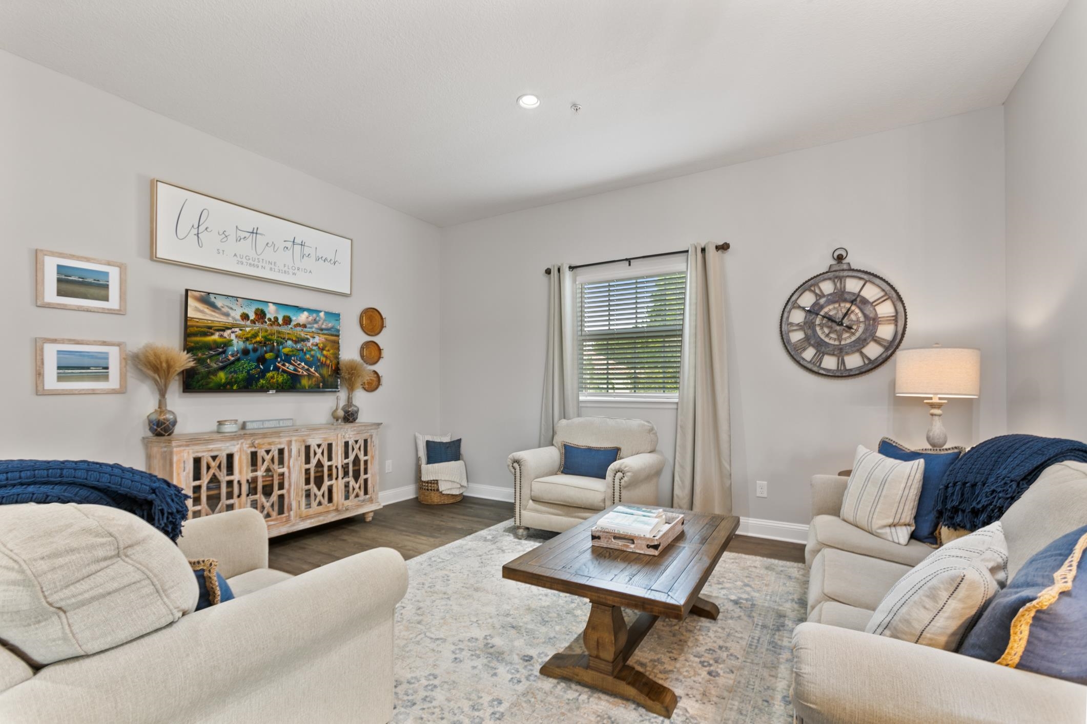 121 Grand Ravine Drive St. Augustine, FL 32086 - Photo 17 of 44 a living room with furniture a rug and a flat screen tv