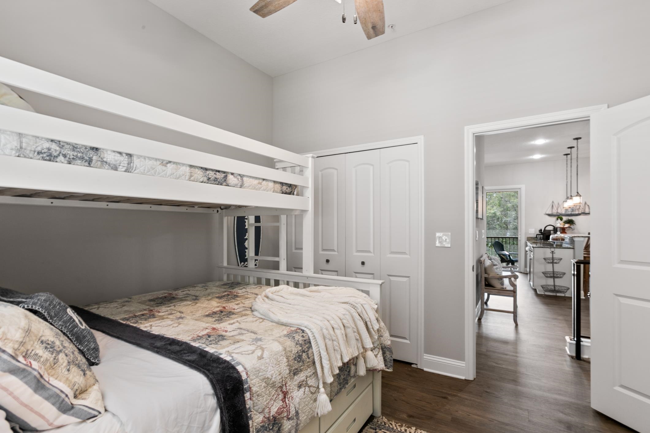 121 Grand Ravine Drive St. Augustine, FL 32086 - Photo 22 of 44 a bedroom with a large bed and wooden floor