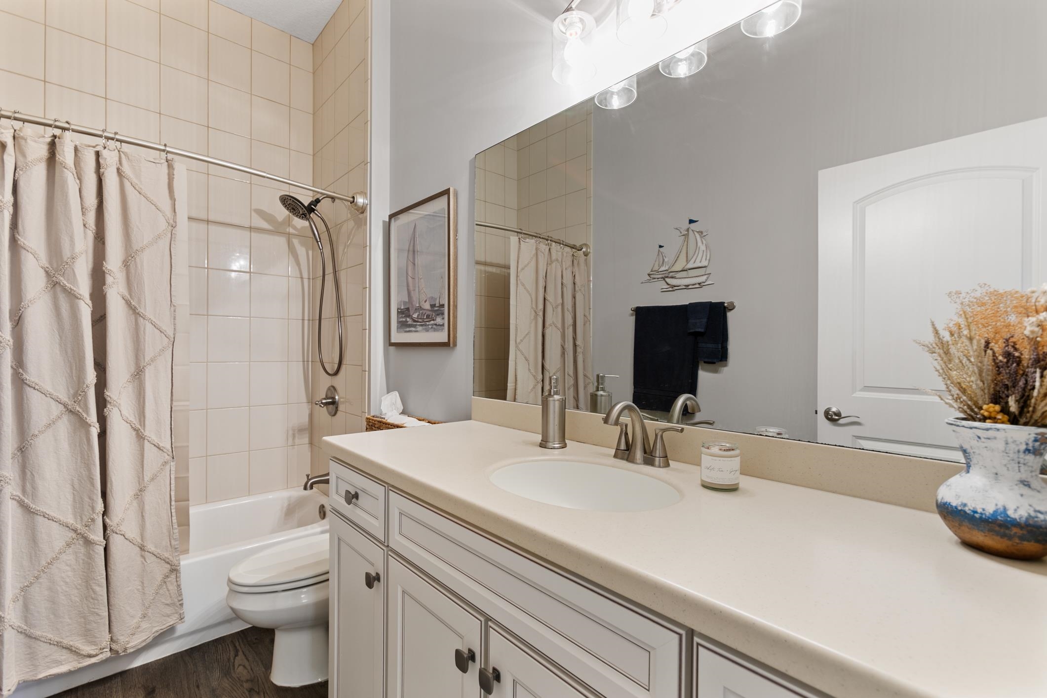 121 Grand Ravine Drive St. Augustine, FL 32086 - Photo 27 of 44 a bathroom with a double vanity sink toilet and shower