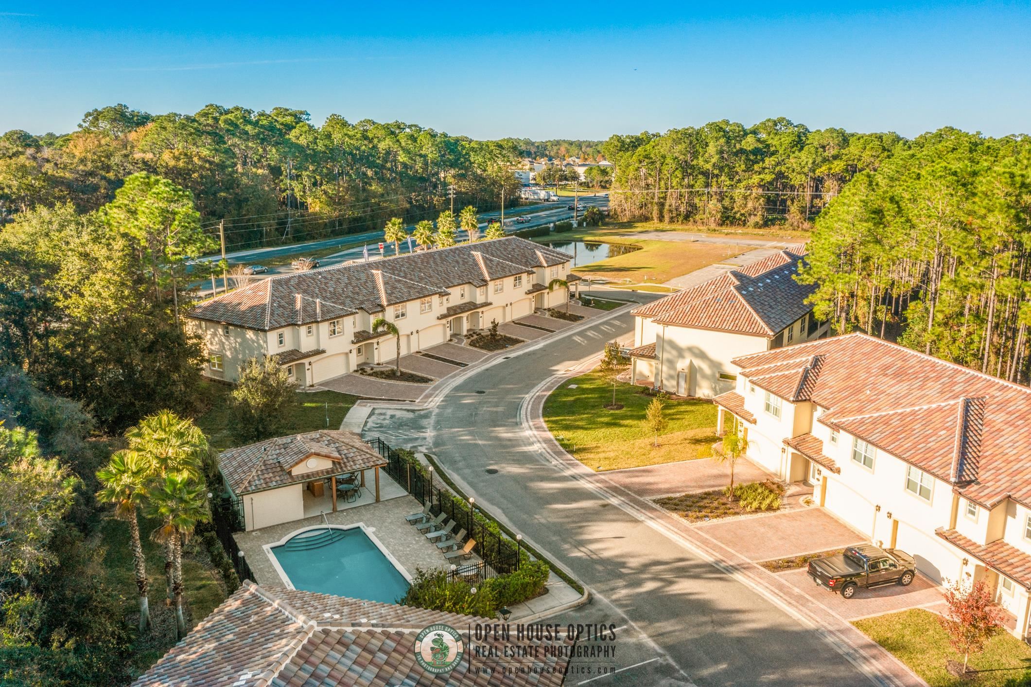 121 Grand Ravine Drive St. Augustine, FL 32086 - Photo 40 of 44 a view of a swimming pool with a patio