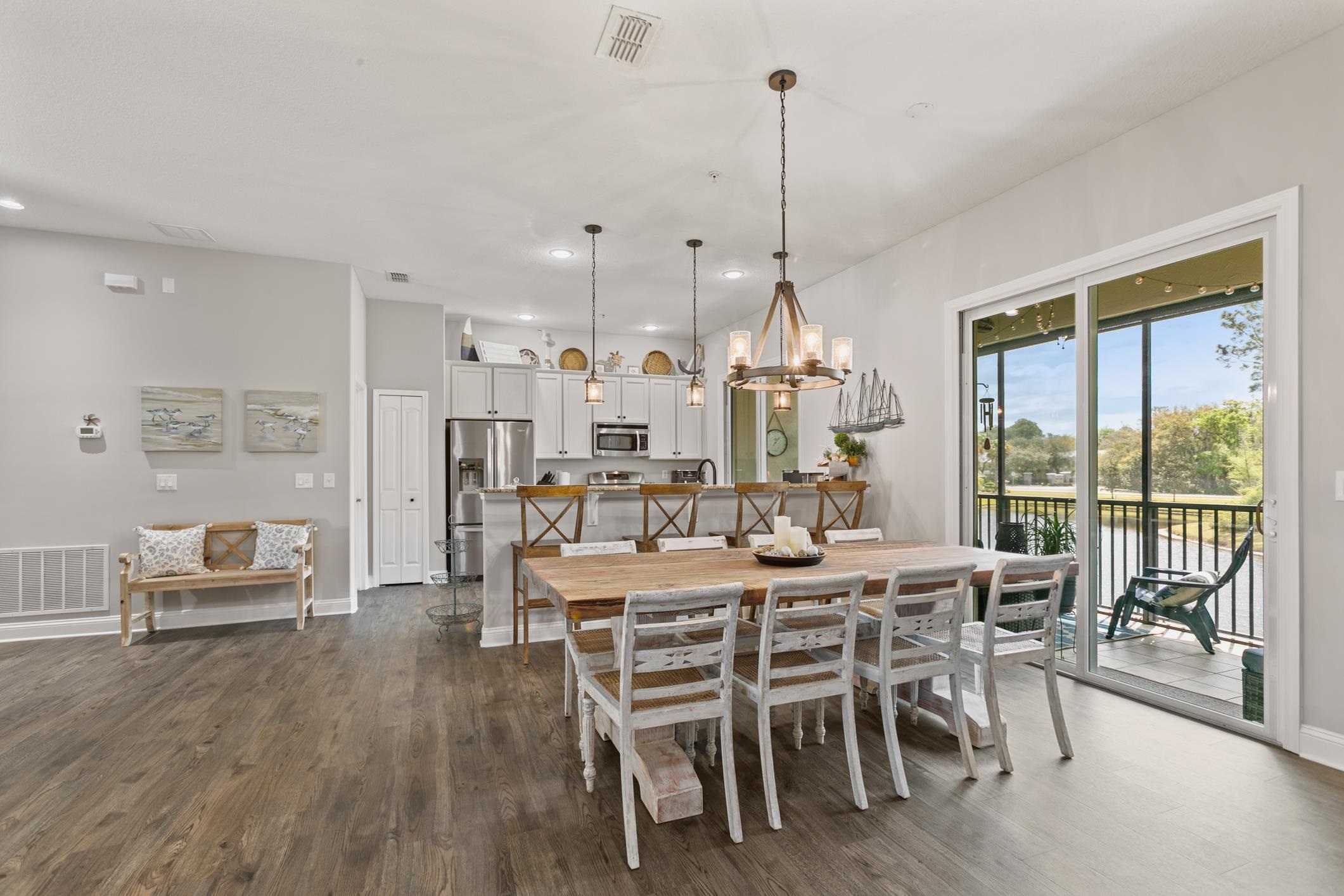 121 Grand Ravine Drive St. Augustine, FL 32086 - Photo 5 of 44 a view of a dining room with furniture window and wooden floor