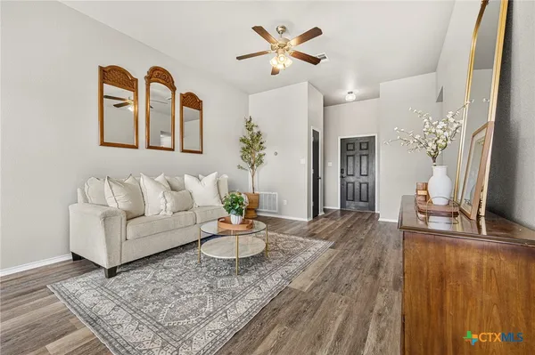a kitchen with stainless steel appliances granite countertop a sink a stove and cabinets