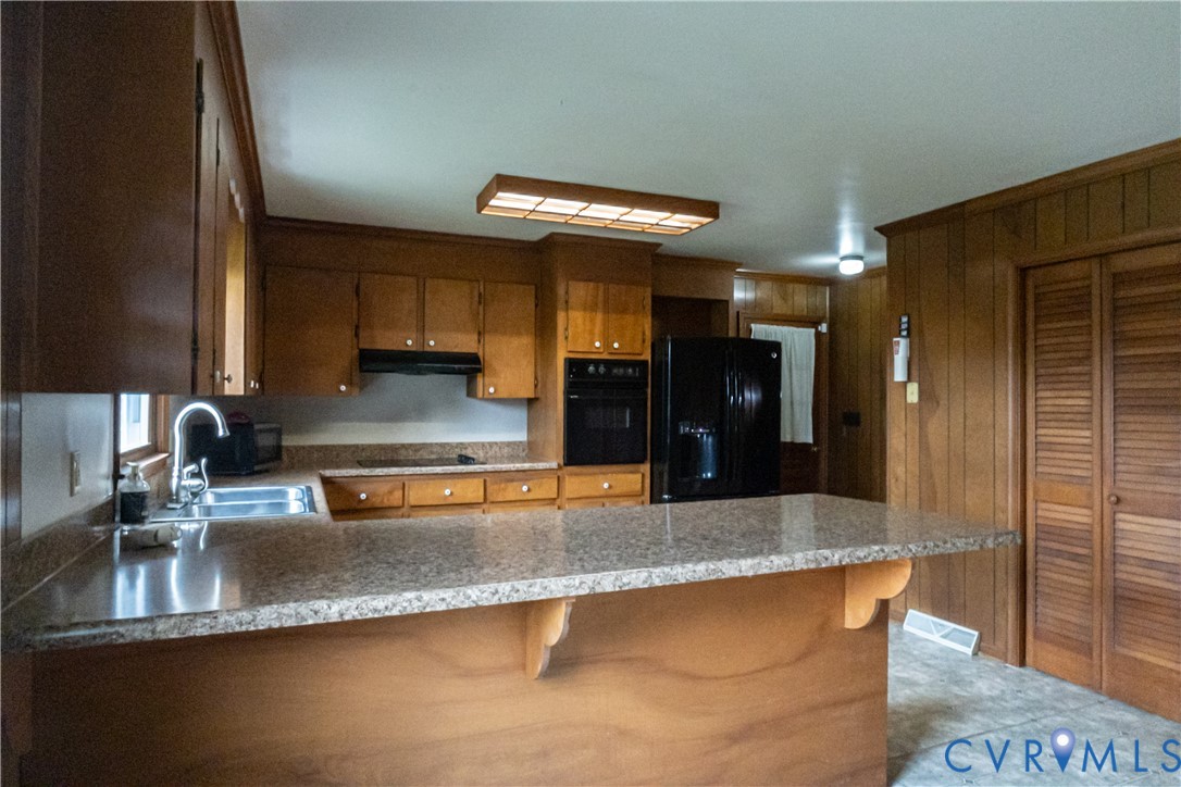 309 Old Plank Road Kenbridge, VA 23944 - Photo 21 of 45 Wood-finish cabinetry with coordinating paneling,