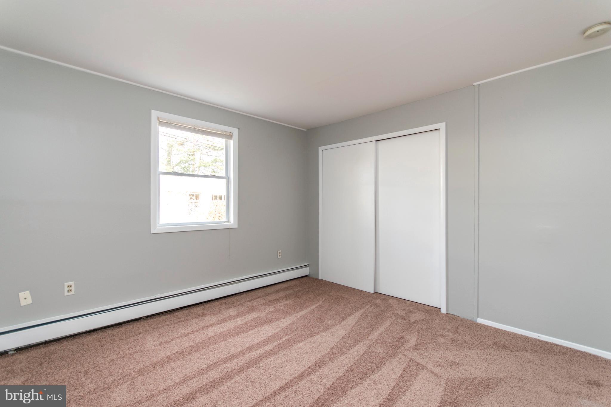 32 Gentle Road Levittown, PA 19057 - Photo 26 of 32 a view of an empty room with wooden floor and a window