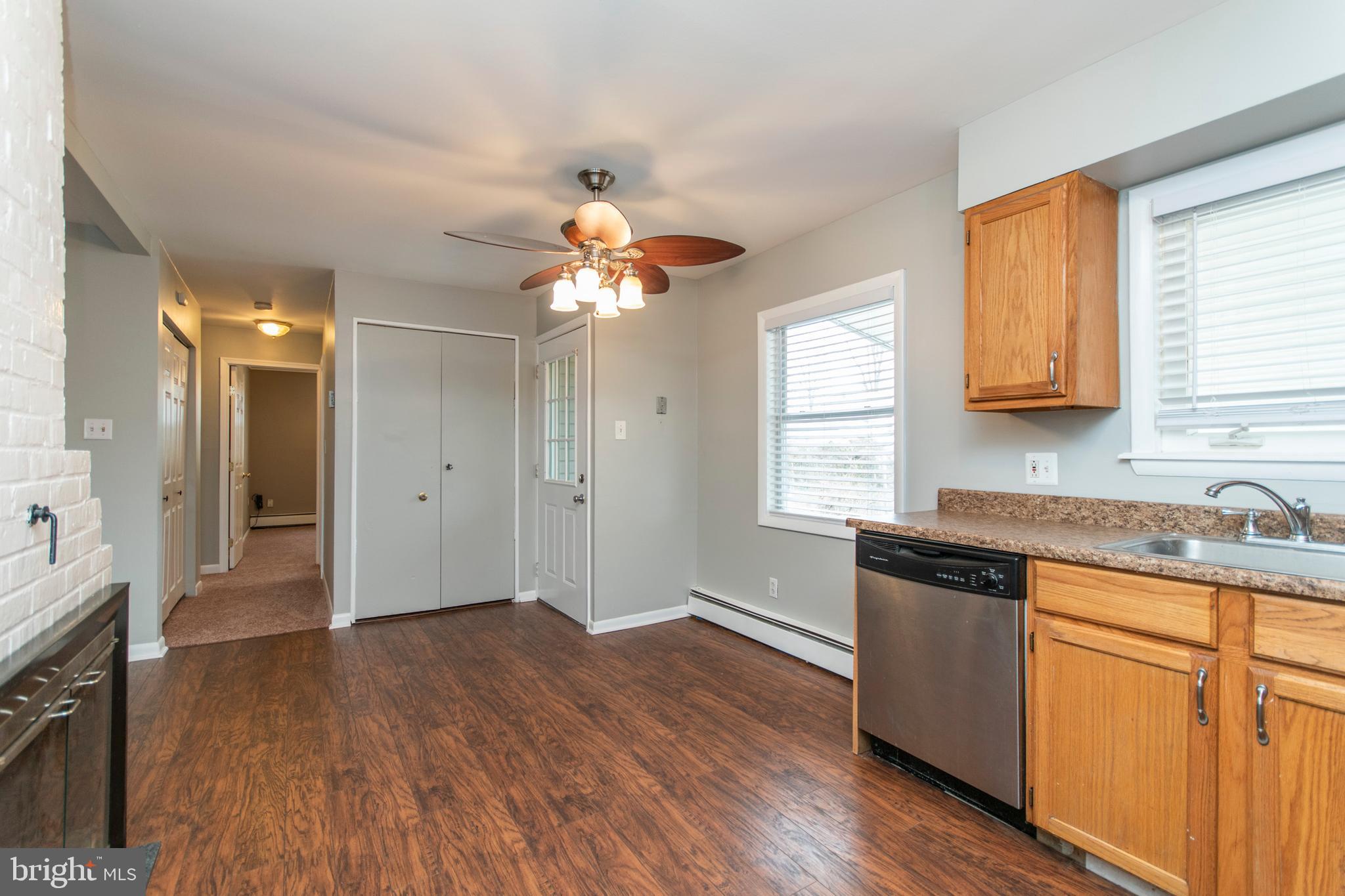 32 Gentle Road Levittown, PA 19057 - Photo 7 of 32 a kitchen with stainless steel appliances granite countertop a sink cabinets and wooden floor