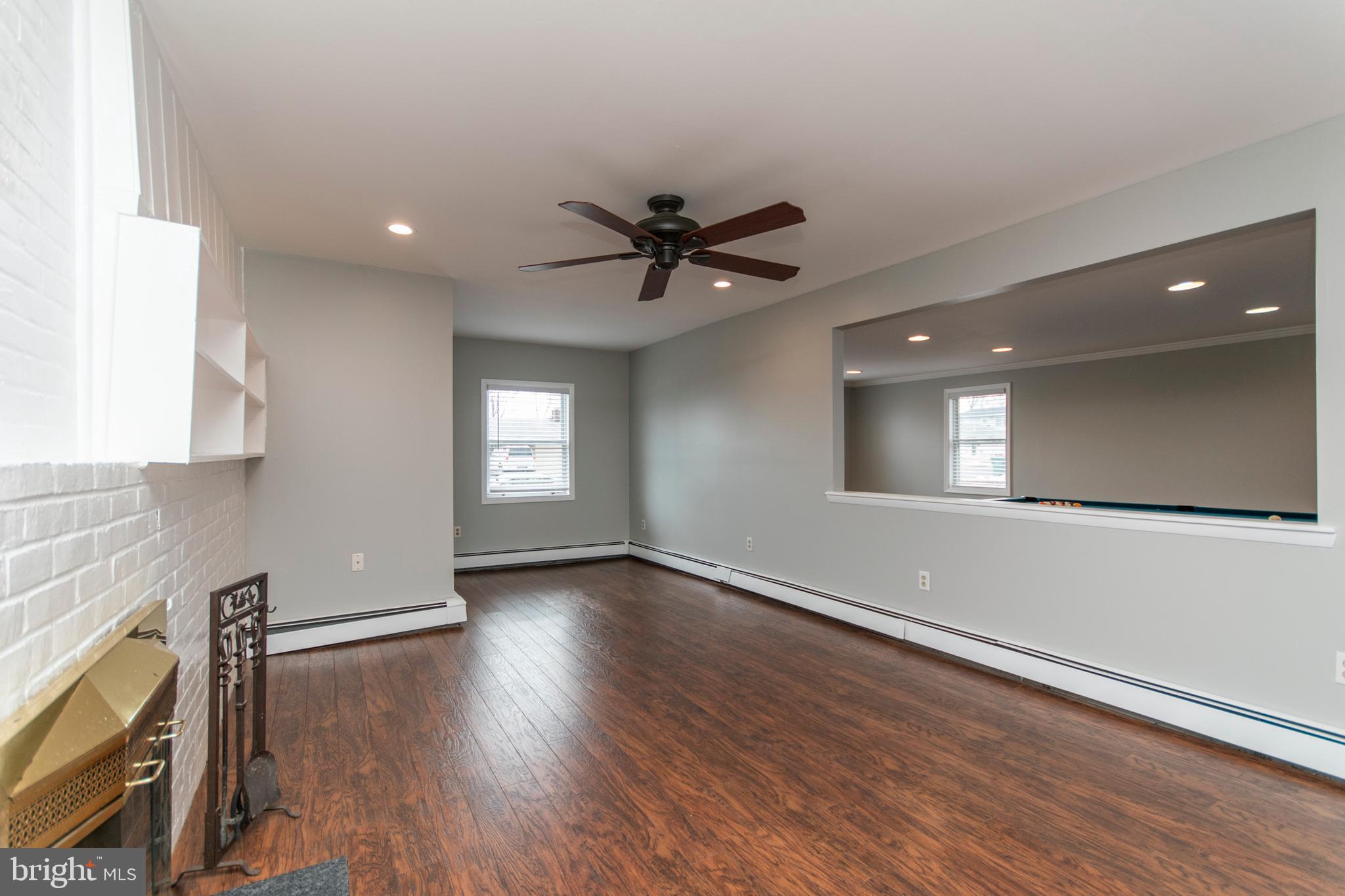 32 Gentle Road Levittown, PA 19057 - Photo 10 of 32 wooden floor in an empty room with a window