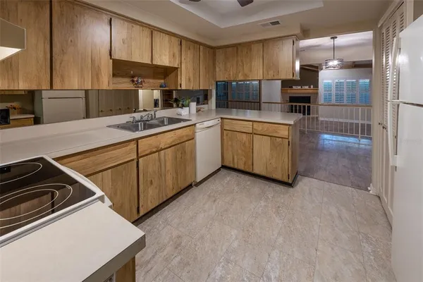 a kitchen with a sink a stove and refrigerator